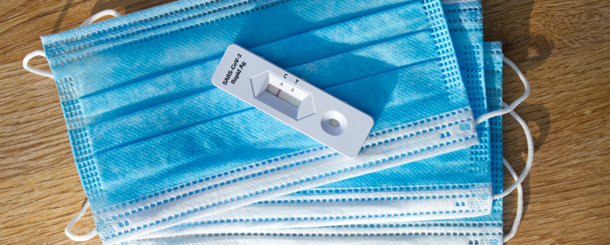lateral-flow-home-testing-header1 Surgical masks and a negative lateral flow rapid antigen test
