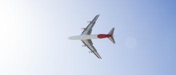 Plane flying across the sky