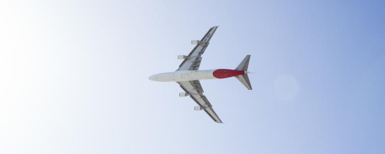 Plane flying across the sky