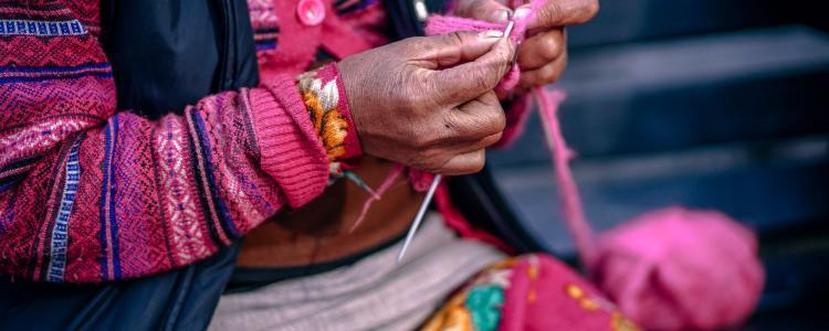 Old woman knitting in south america