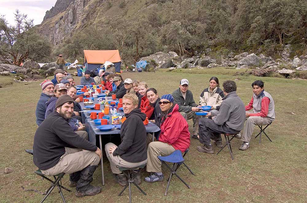 Travellers and guides eat breakfast at Paccha on the Inca trail