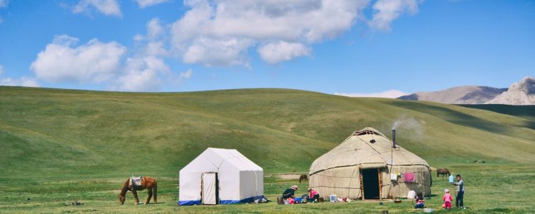 A Nomadic family and their horse in Kyrgyzstan