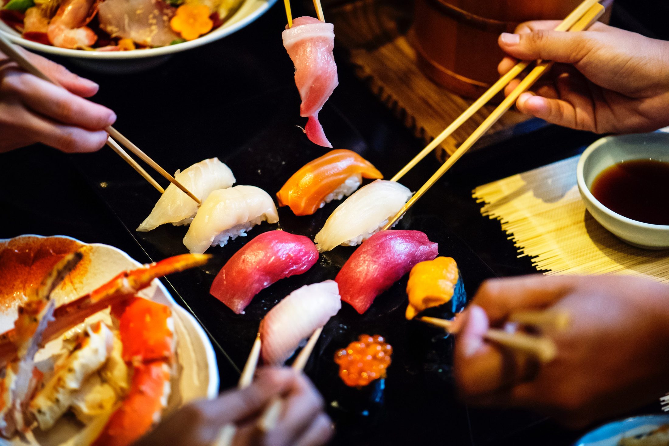 People sharing a platter of sushi