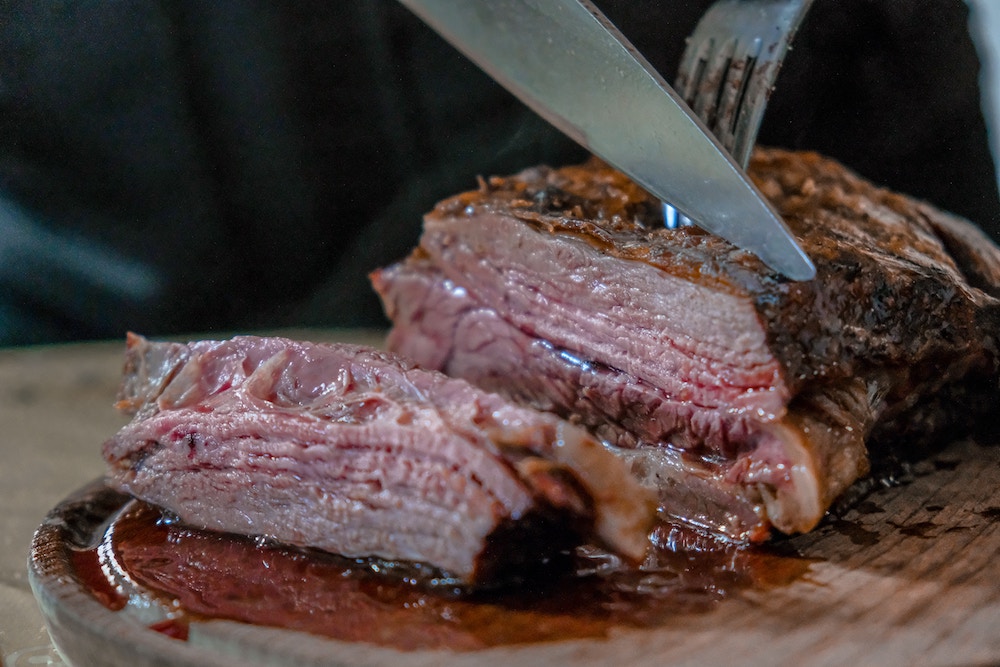 Cooked meat being carved