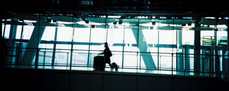 Person arriving at an airport with luggage