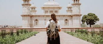 Woman standing looking at a temple in Agra, India