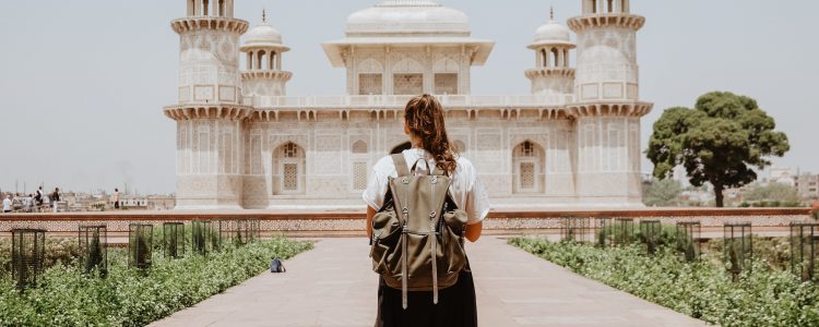 Woman standing looking at a temple in Agra, India