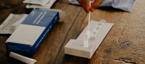 A person takes a COVID self-test