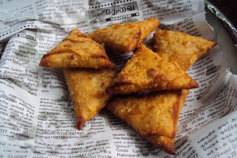Fresh samosas on Sri Lankan newspaper