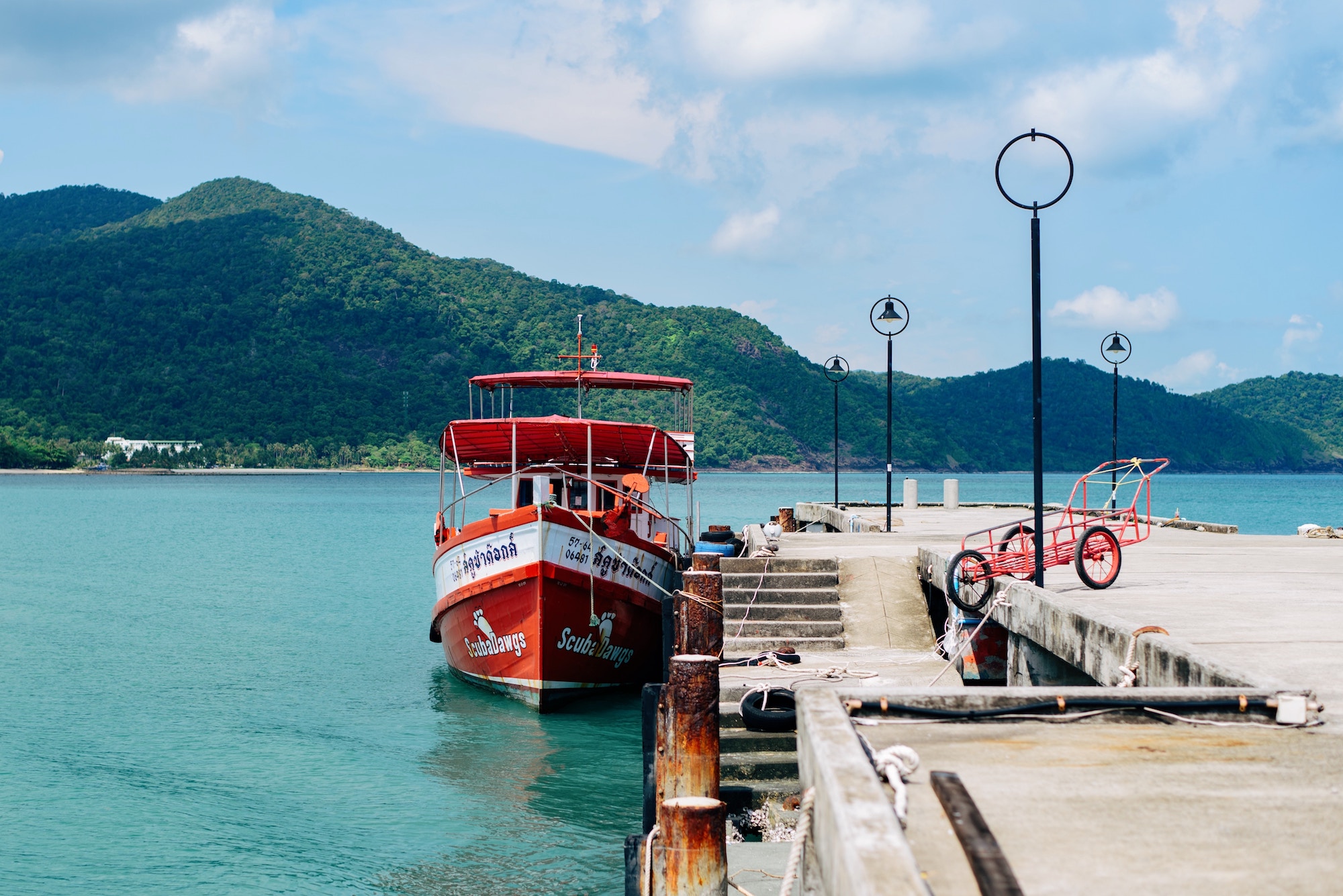 A boat docked on a jetty in Thailand