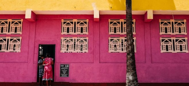 A brightly coloured pink and yellow building in Sri Lanka